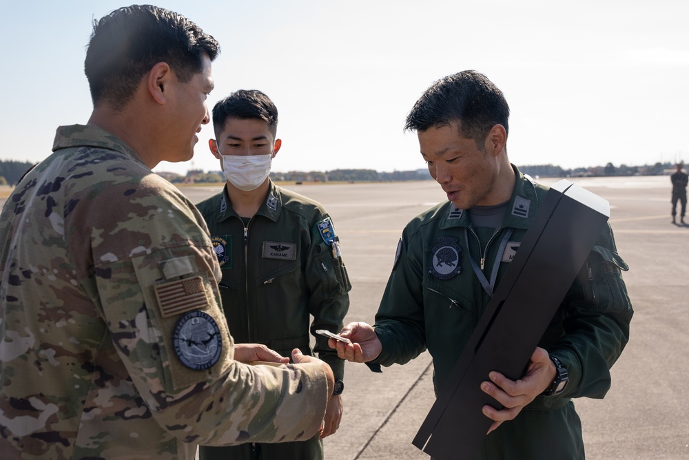 27th Special Operation Wing members receive Japanese Self-Defense Force members at Yokota Air Base, Japan