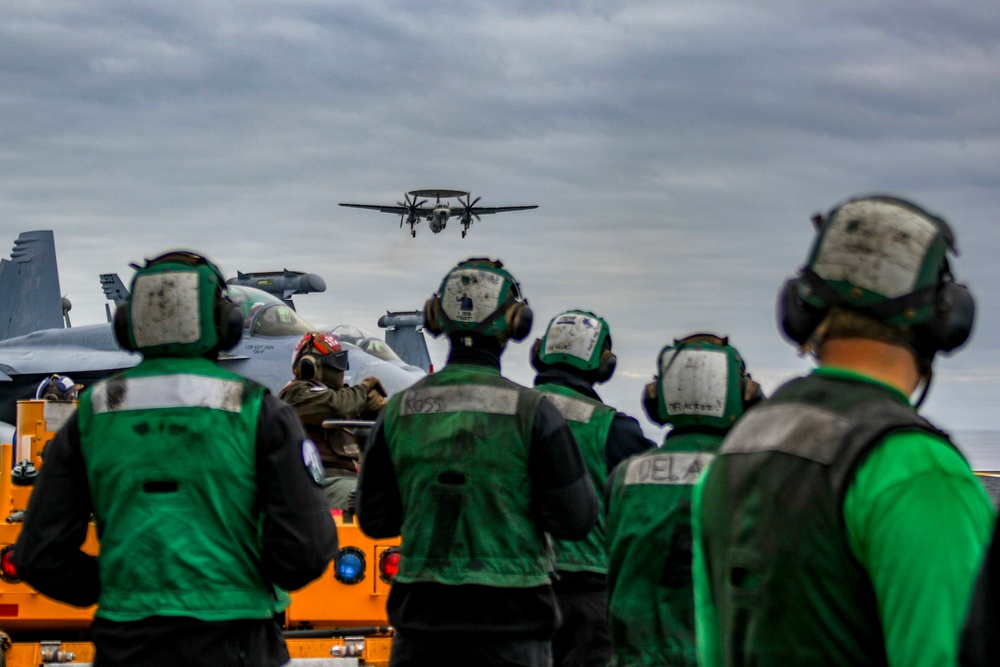 Sailors an E-2D Hawkeye Land Aboard Abraham Lincoln