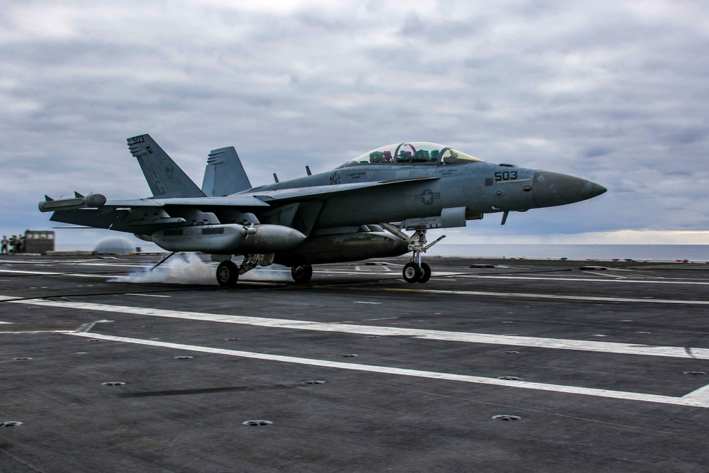 An EA-18G Growler makes an arrested landing on the flight deck Abraham Lincoln