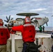 Sailors observe flight operations on the flight deck of Abraham Lincoln