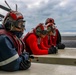 Sailors observe flight operations on the flight deck of Abraham Lincoln