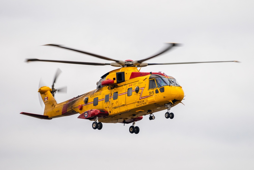 Royal Canadian Air Force helicopter crew visits Coast Guard Air Station Astoria