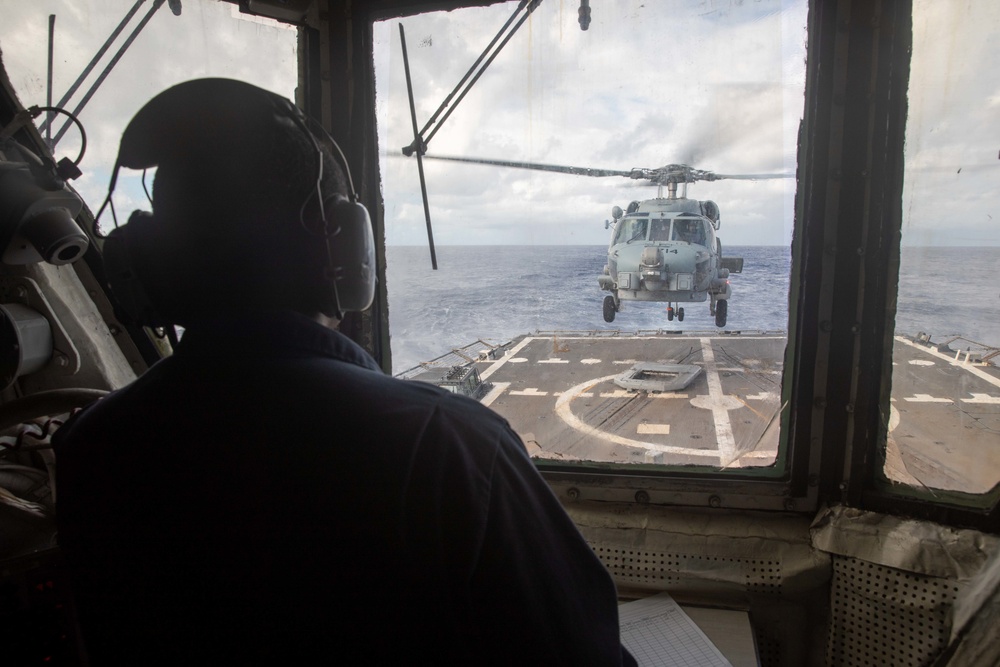 MH-60R Sea Hawk from the “Battlecats” of HSM 73 prepares to land on the flight deck of DDG 93