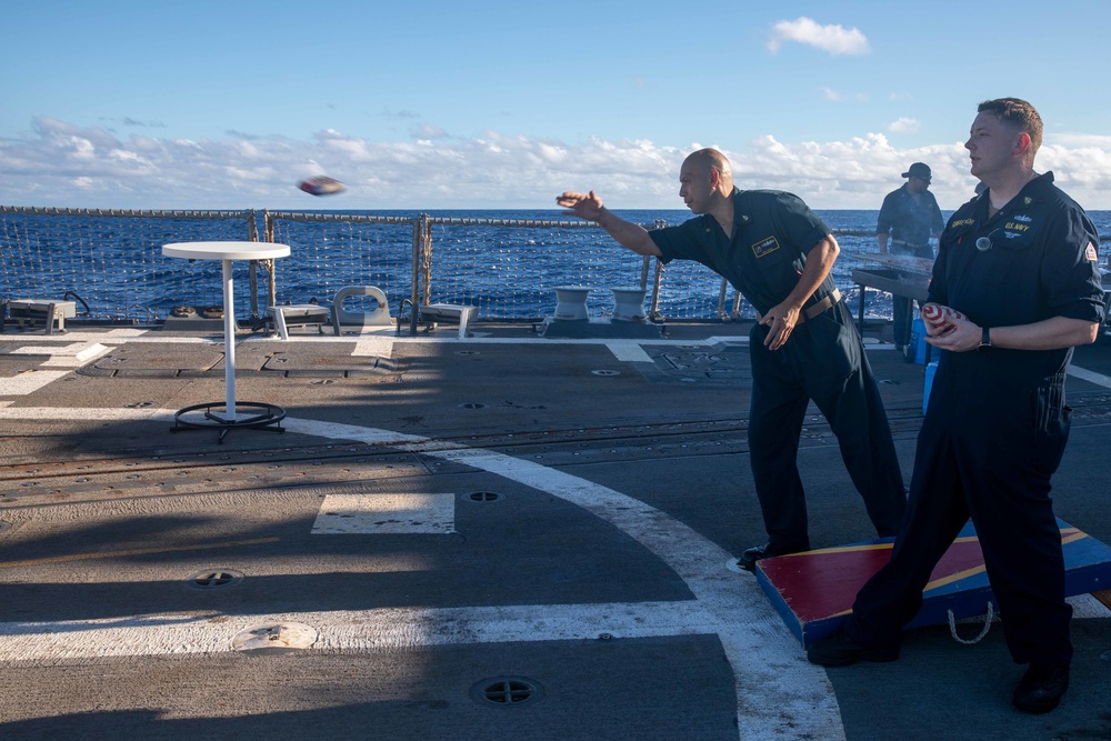 U.S. Navy sailors play corn hole aboard USS Chung-Hoon