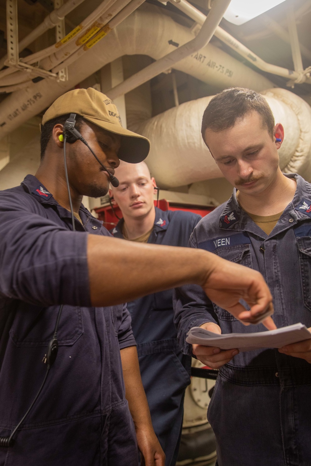 U.S. Navy Sailors take part in engineering and damage control training drills aboard USS Chung-Hoon