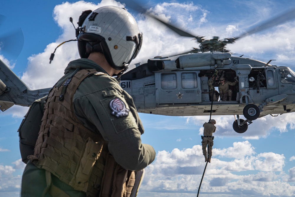 Sailors Fast Rope Onto Flight Deck