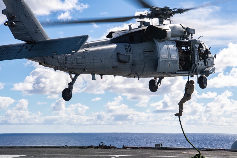 Sailors Fast Rope Onto Flight Deck