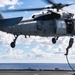 Sailors Fast Rope Onto Flight Deck