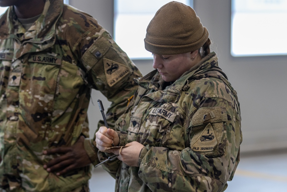 U.S. Army Soldier annotates readings from a recent fuel test