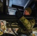 Aerial porter ties down firetruck aboard C-17