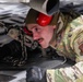 Aerial porter ties down firetruck to a C-17