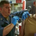 USS The Sullivans administers flu vaccines to crew