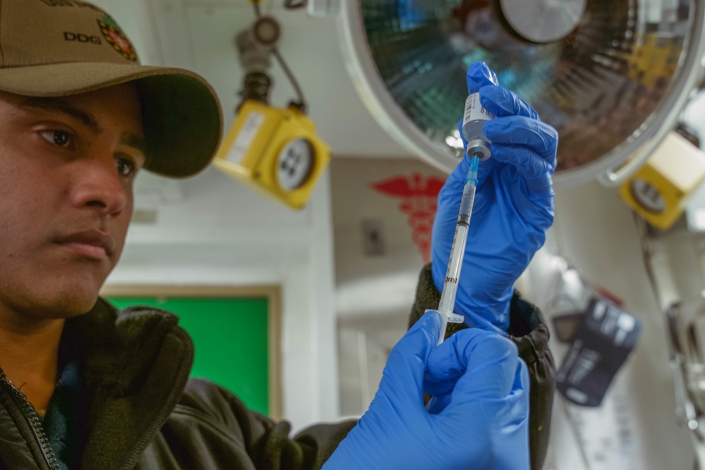 USS The Sullivans administers flu vaccines to crew