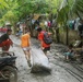 City Officials, Security Force Personnel Clean Up Flooded Zamboanga