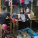 City Officials, Security Force Personnel Clean Up Flooded Zamboanga