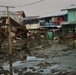 City Officials, Security Force Personnel Clean Up Flooded Zamboanga