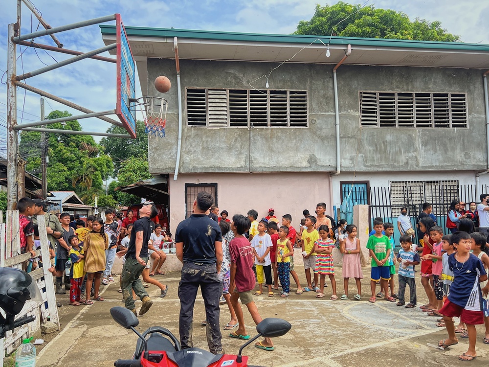 City Officials, Security Force Personnel Clean Up Flooded Zamboanga