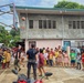 City Officials, Security Force Personnel Clean Up Flooded Zamboanga