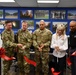 Joint Base Myer-Henderson Hall leadership and representatives with the USO cut the ribbon for the USO game room opening