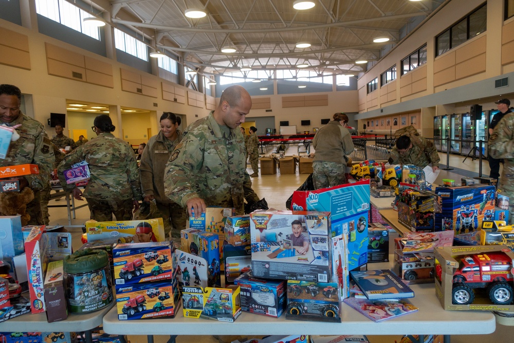 Airmen select toys at Spark of Love 2022