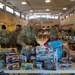 Airmen select toys at Spark of Love 2022