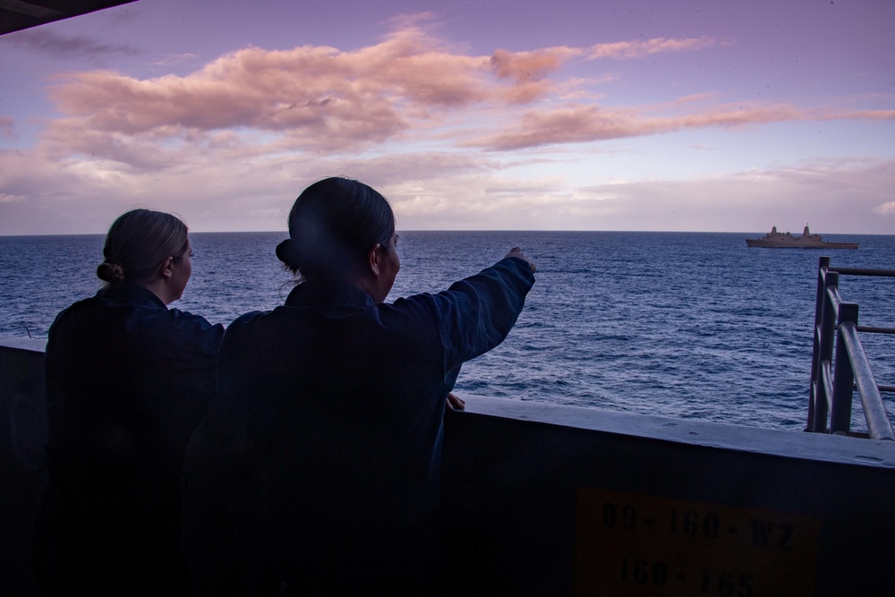 Sailors Observe a Passing Ship