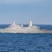 USS Portland (LPD 27)  sails alongsideUSS Carl Vinson (CVN 70)