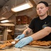 Sailor Moves Cookies To Serving Tray