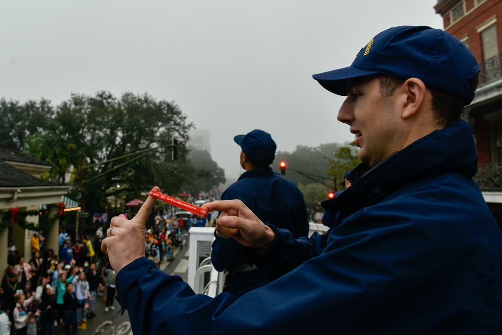 Coast Guard members participate in the Bayou Classic Parade