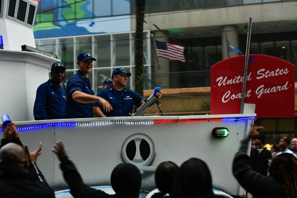 Coast Guard members participate in the Bayou Classic Parade
