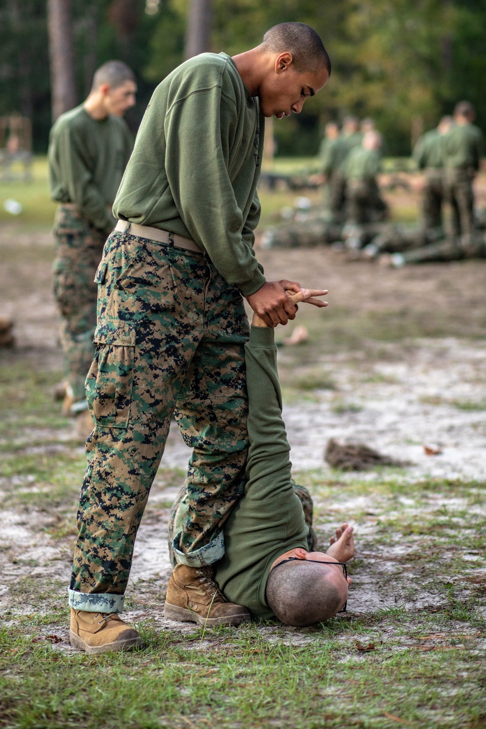 A recruit from Mike Company, 3rd Recruit Training Battalion, applies a choke  hold during a Marine Corps Martial Arts Program test at Marine Corps  Recruit Depot San Diego, July 20. The recruits