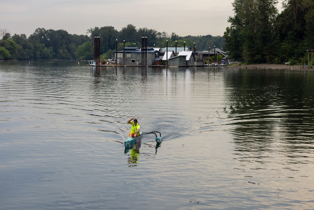 A Kayaker with an Outrigger Paddles the Willamette River, Ore.