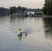 A Kayaker with an Outrigger Paddles the Willamette River, Ore.