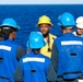 U.S. Navy Sailors conduct safety brief prior to underway replenishment