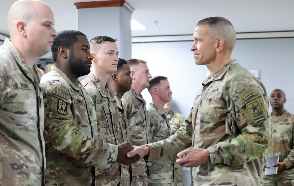 SMA Grinston gives coins to Soldiers while visiting Camp Arifjan, December, 2022