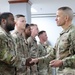 SMA Grinston gives coins to Soldiers while visiting Camp Arifjan, December, 2022