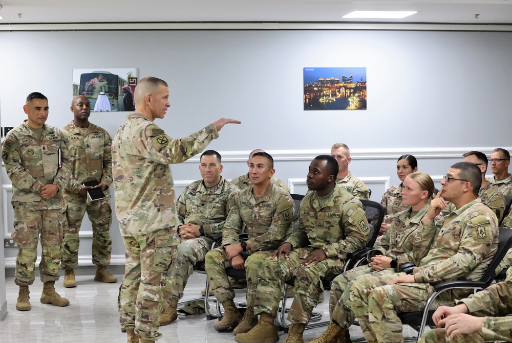 SMA Grinston gives coins to Soldiers while visiting Camp Arifjan, December, 2022