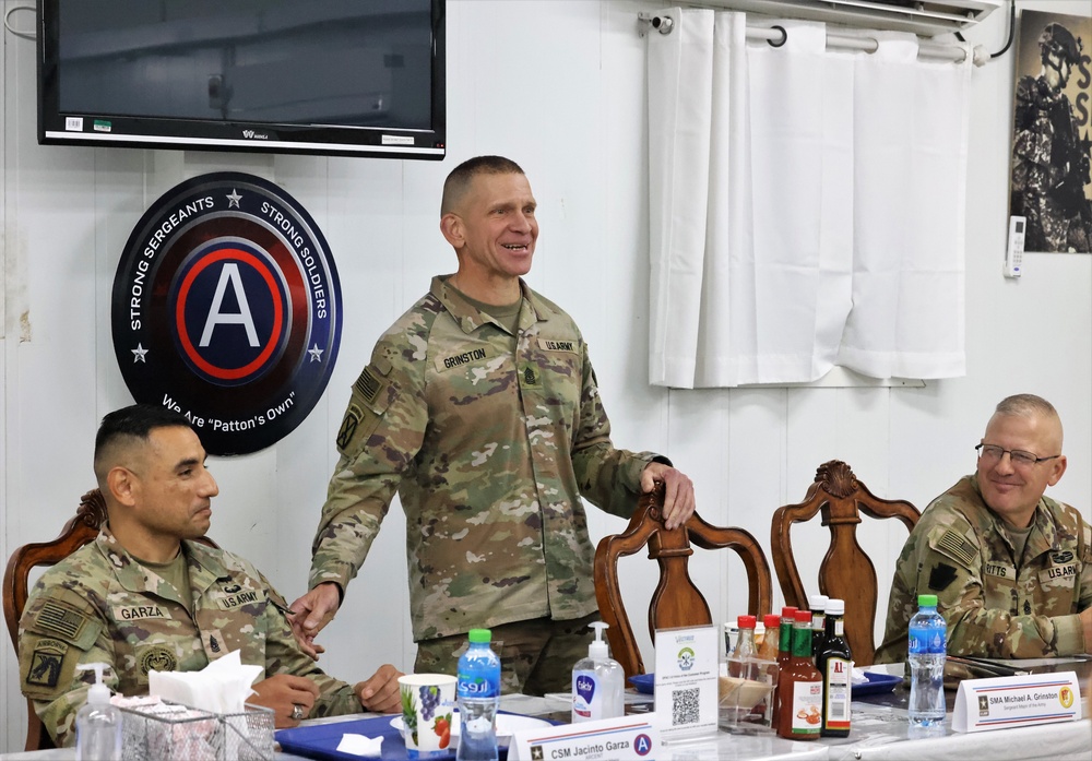 SMA Grinston gives coins to Soldiers while visiting Camp Arifjan, December, 2022