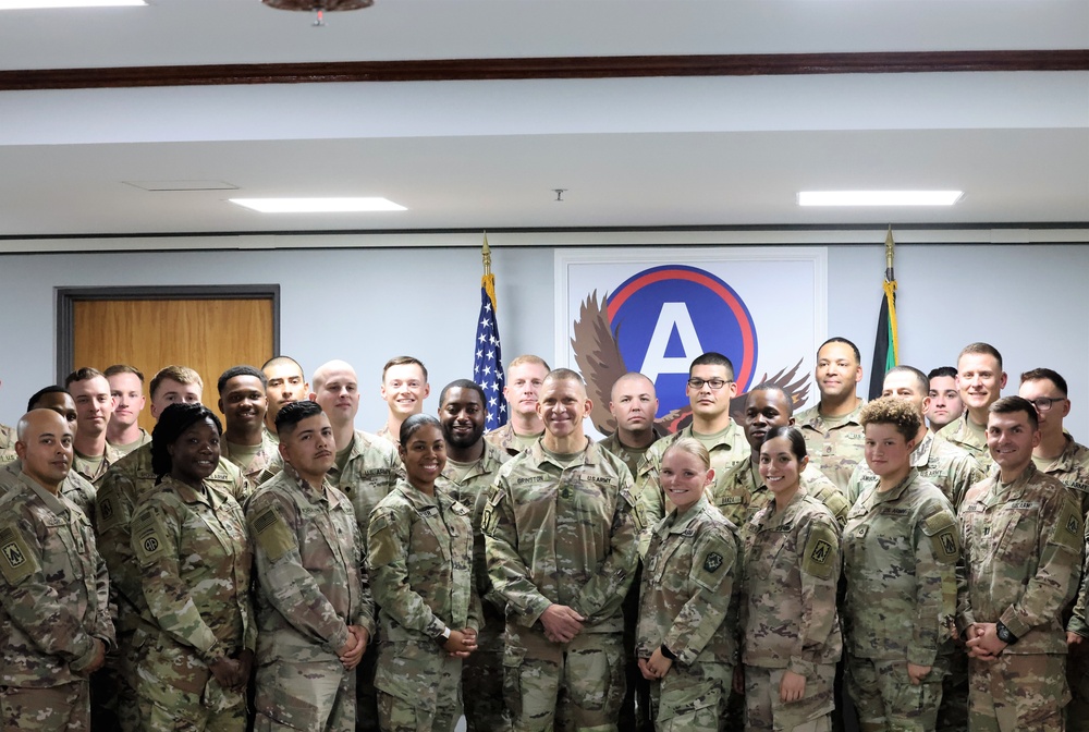 SMA Grinston gives coins to Soldiers while visiting Camp Arifjan, December, 2022