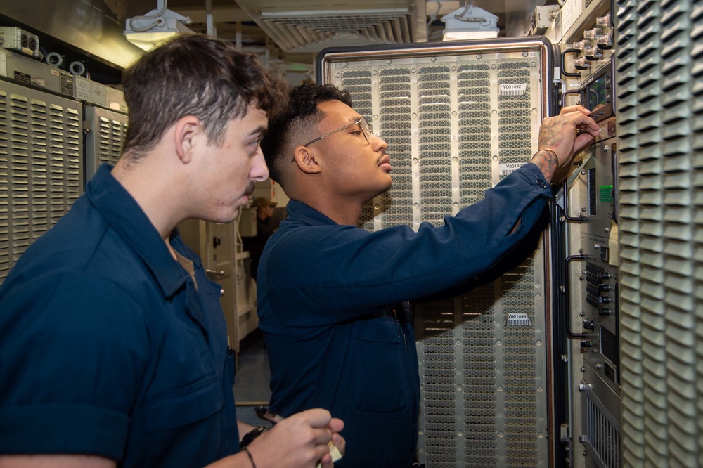 USS Ronald Reagan (CVN) 76 Sailors set up a high frequency radio circuit