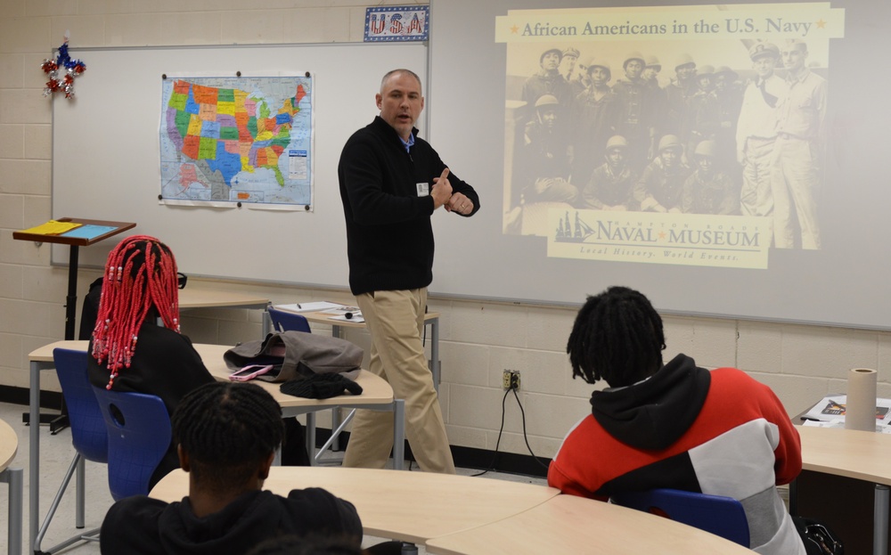 Naval Museum staff present a history presentation to students enrolled at Nansemond River High School in Suffolk, Virginia