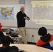 Naval Museum staff present a history presentation to students enrolled at Nansemond River High School in Suffolk, Virginia