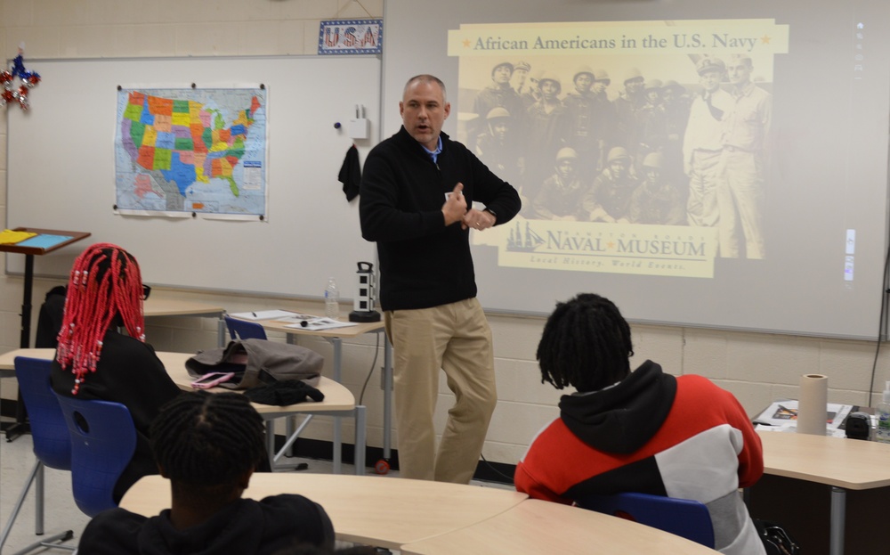 Naval Museum staff present a history presentation to students enrolled at Nansemond River High School in Suffolk, Virginia