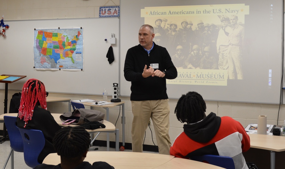 Naval Museum staff present a history presentation to students enrolled at Nansemond River High School in Suffolk, Virginia