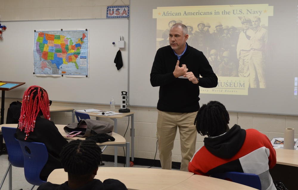 Naval Museum staff present a history presentation to students enrolled at Nansemond River High School in Suffolk, Virginia