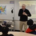 Naval Museum staff present a history presentation to students enrolled at Nansemond River High School in Suffolk, Virginia