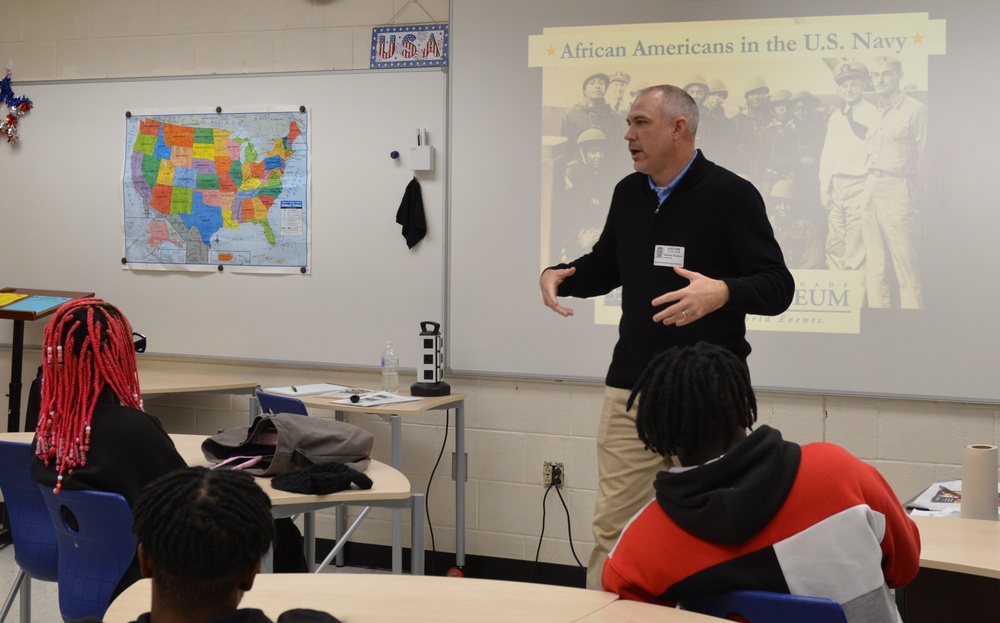 Naval Museum staff present a history presentation to students enrolled at Nansemond River High School in Suffolk, Virginia