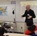 Naval Museum staff present a history presentation to students enrolled at Nansemond River High School in Suffolk, Virginia