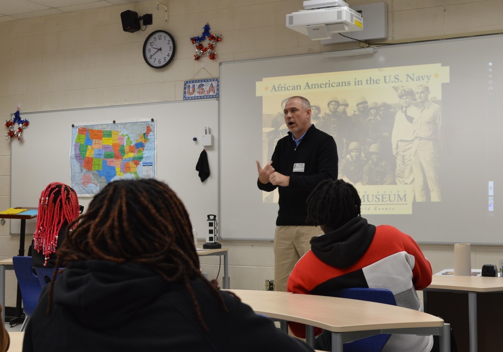 Naval Museum staff present a history presentation to students enrolled at Nansemond River High School in Suffolk, Virginia