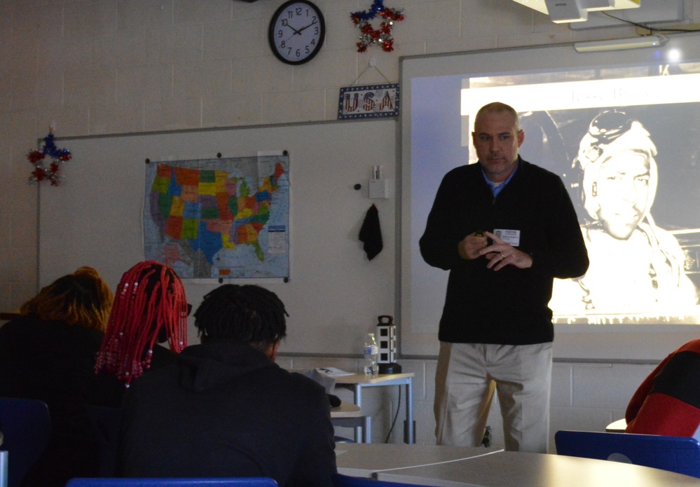 Naval Museum staff present a history presentation to students enrolled at Nansemond River High School in Suffolk, Virginia